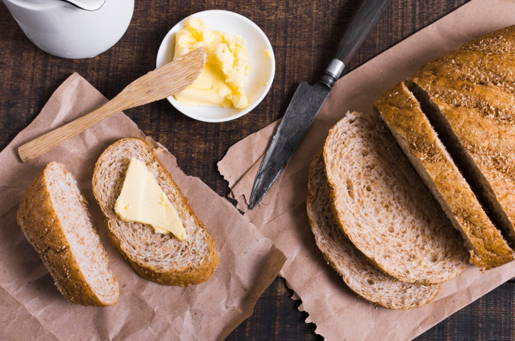 Freshly baked Cottage Cheese Bread on a wooden cutting board.