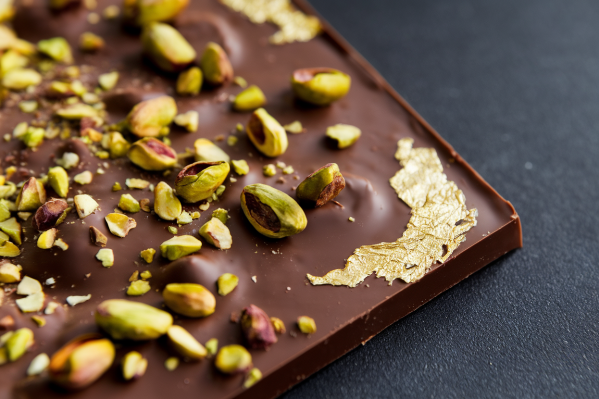 Pistachio chocolate bar on a marble countertop