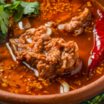 Rich birria broth with traditional Mexican spices and chilies